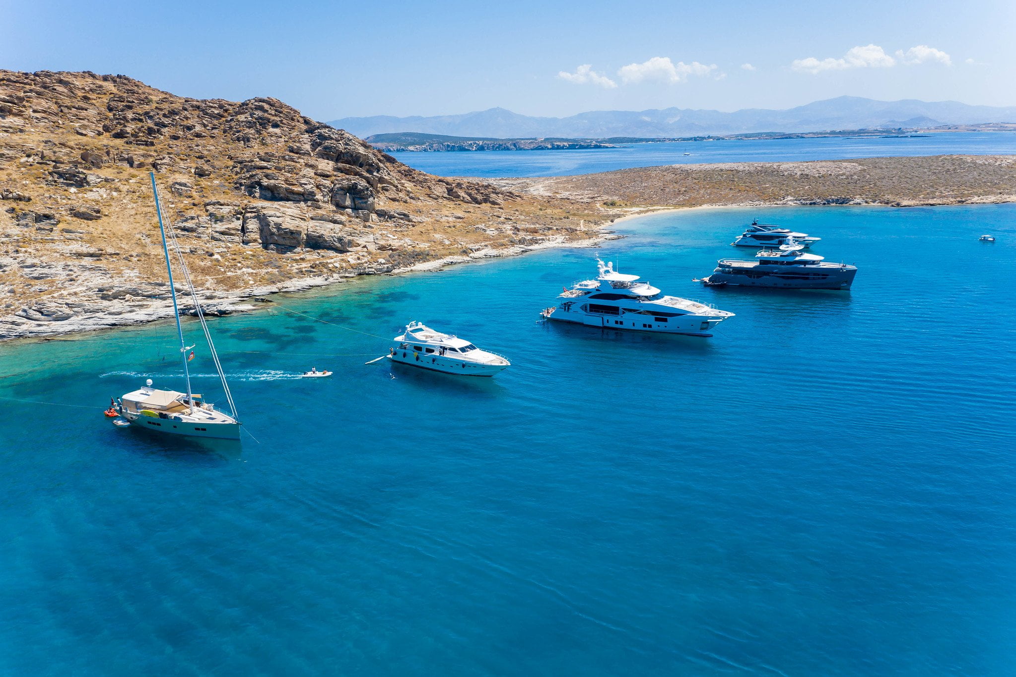 Luxury Yachts Between Tourkou Ammos and Monastiri Beach on Paros - greece insiders blog
