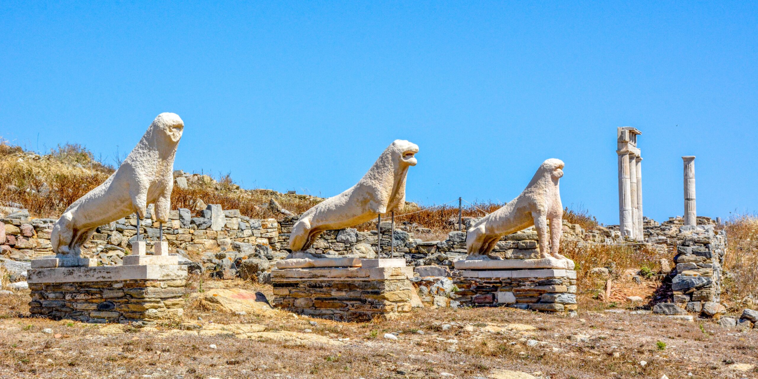 Ancient stone lions stand guard over the ruins on Delos Island, silently telling tales of Greece's rich history.