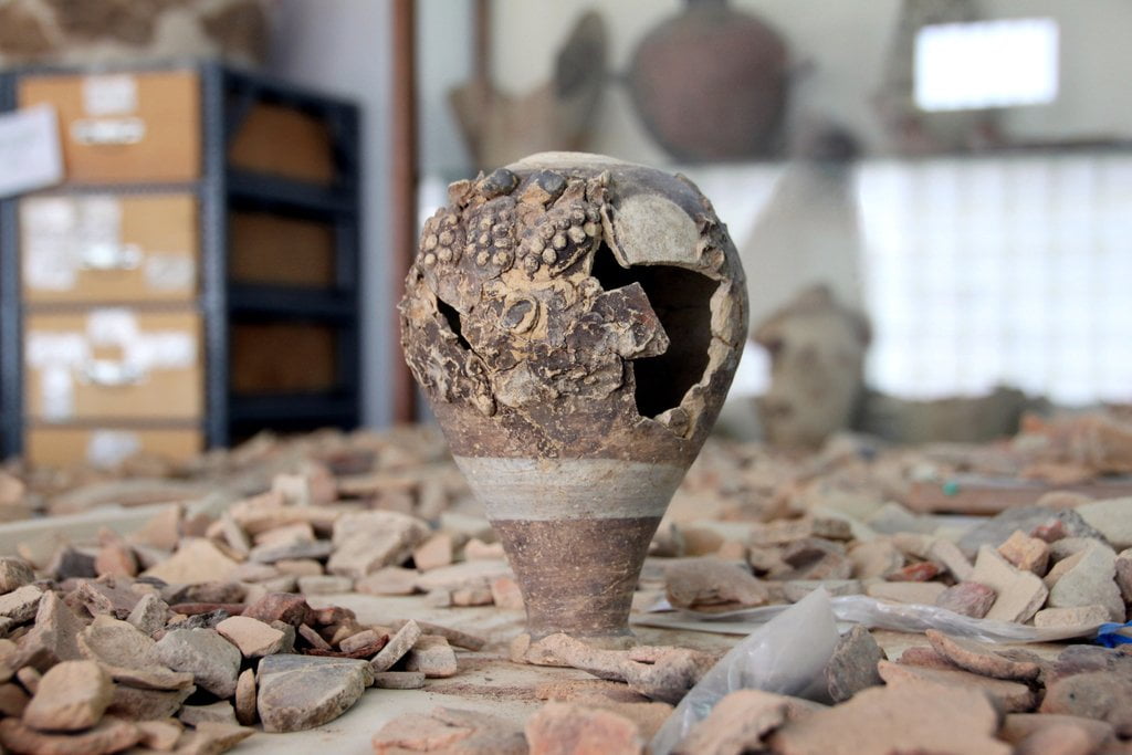 Vessel with relief representaitons of vines
