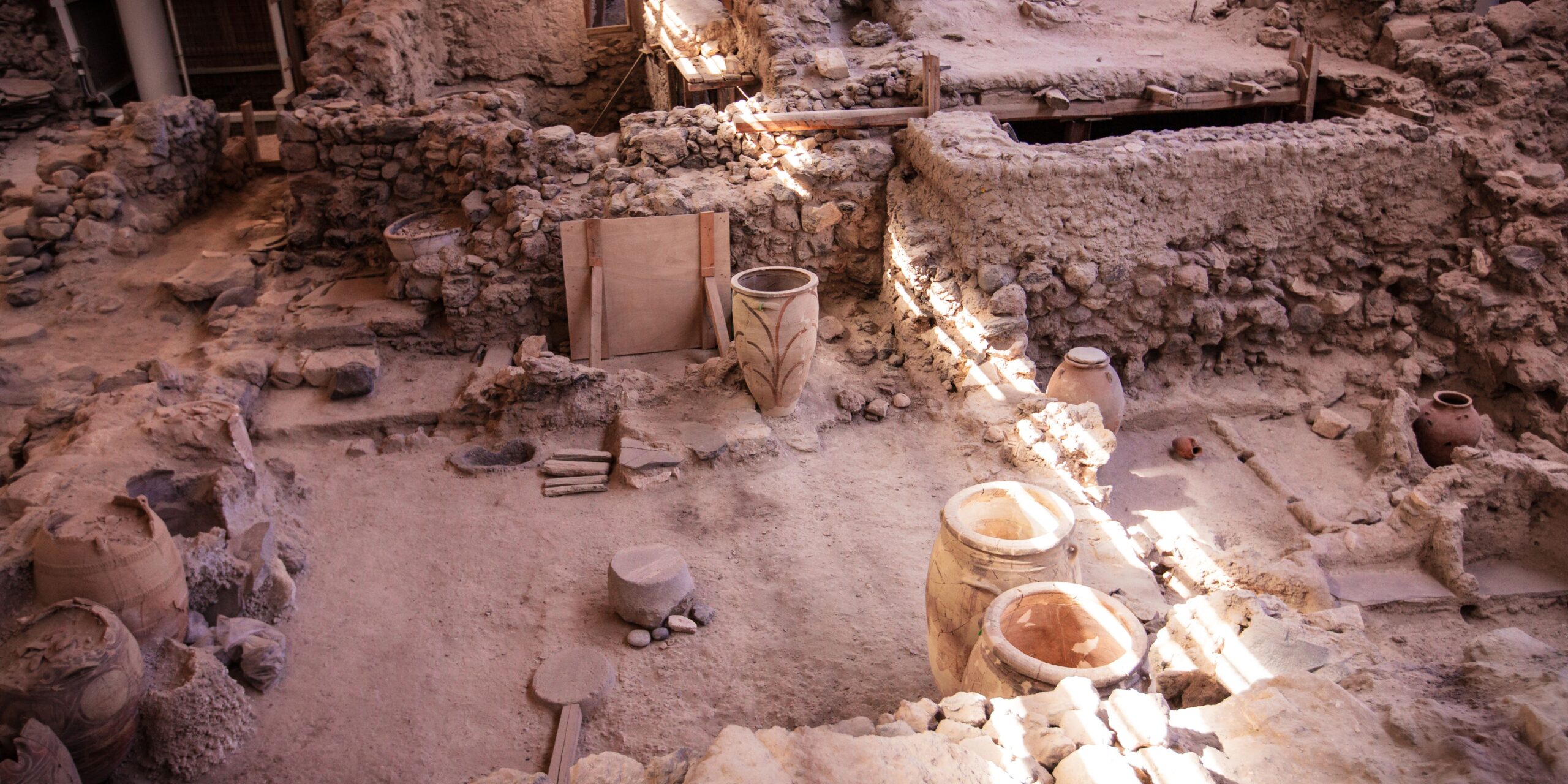 akrotiri archaeological site in santorini with two big minoan vases