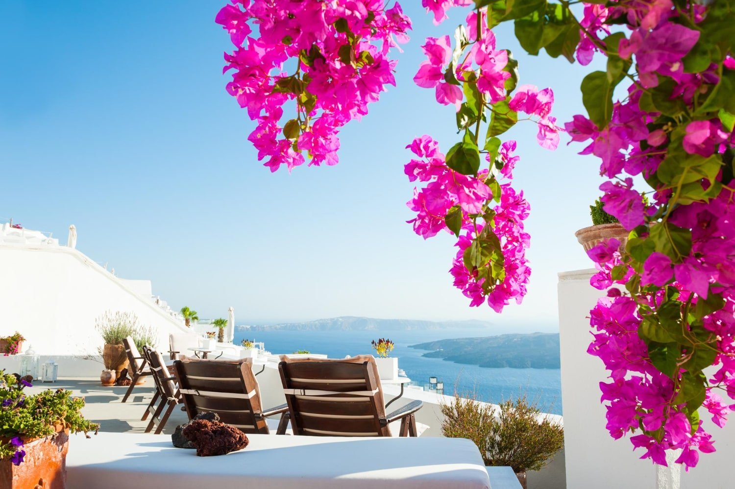 greek island sunbeds sea view flowers