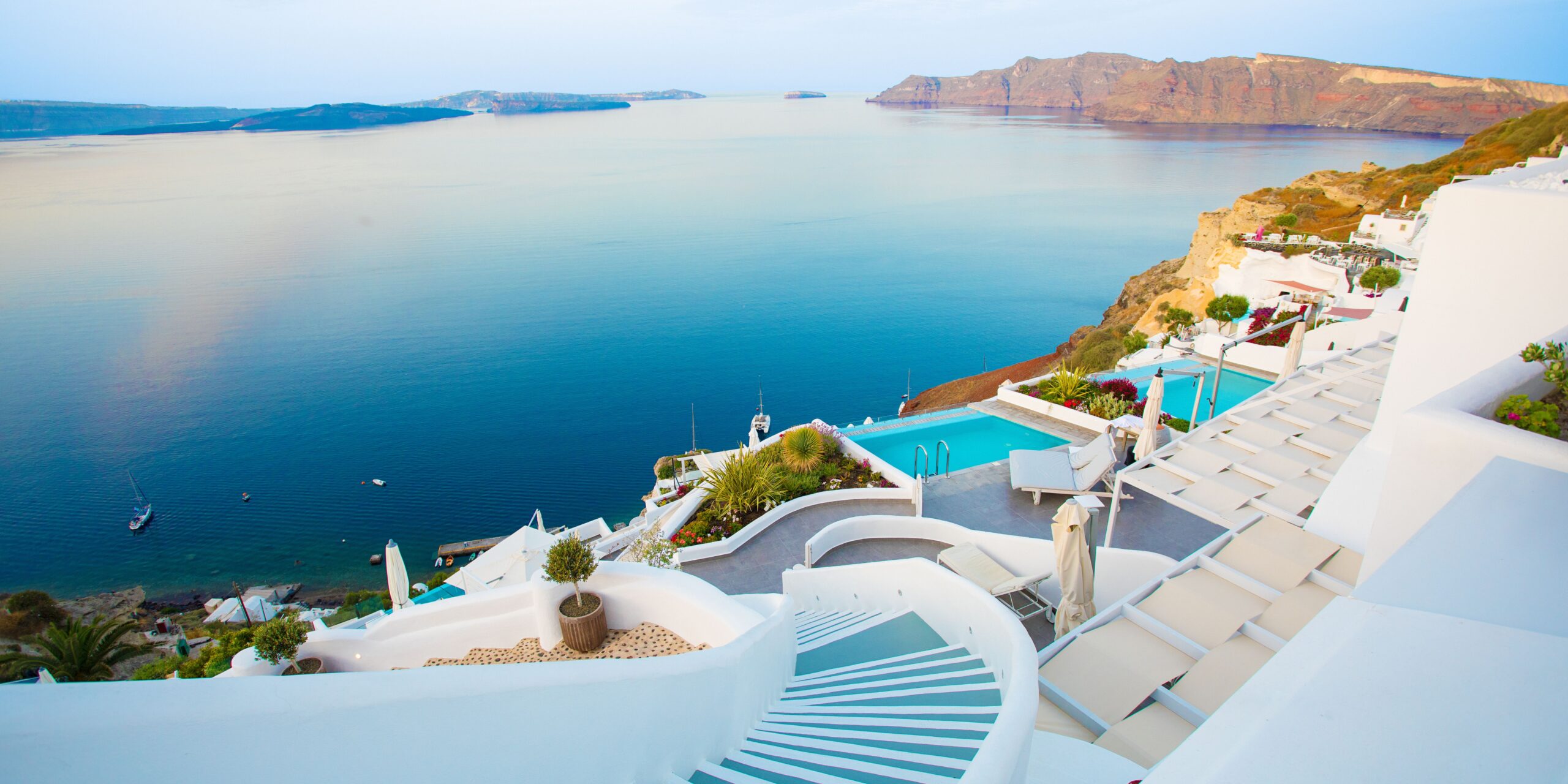 hotel in santorini overlooking the caldera with private pools