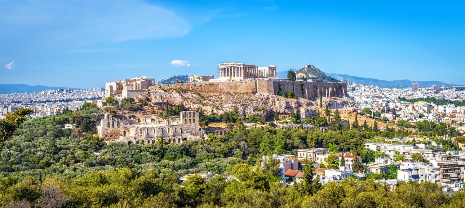 panorama athens with acropolis and green hills around