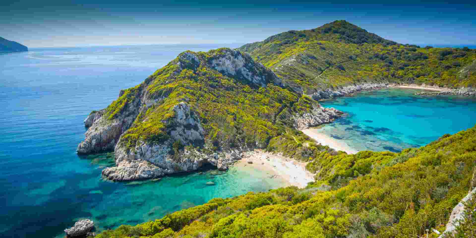 High angle view on beautiful Porto Timoni beach in Corfu. Located in the Ionian Sea of Greece the idyllic beach is surround by crystal clear turquoise water. Corfu beach_feature