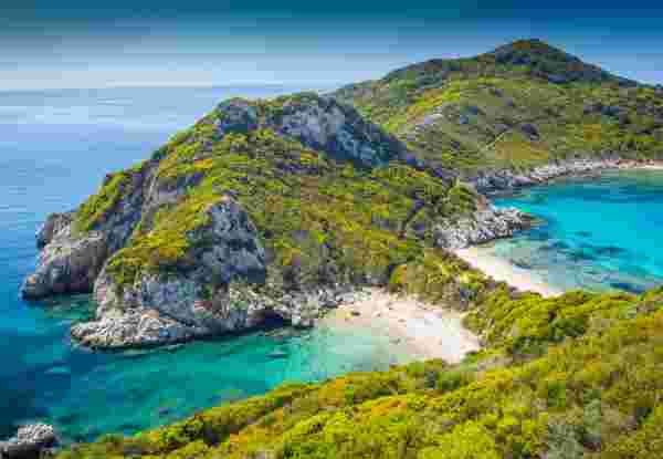 High angle view on beautiful Porto Timoni beach in Corfu. Located in the Ionian Sea of Greece the idyllic beach is surround by crystal clear turquoise water. Corfu beach_feature