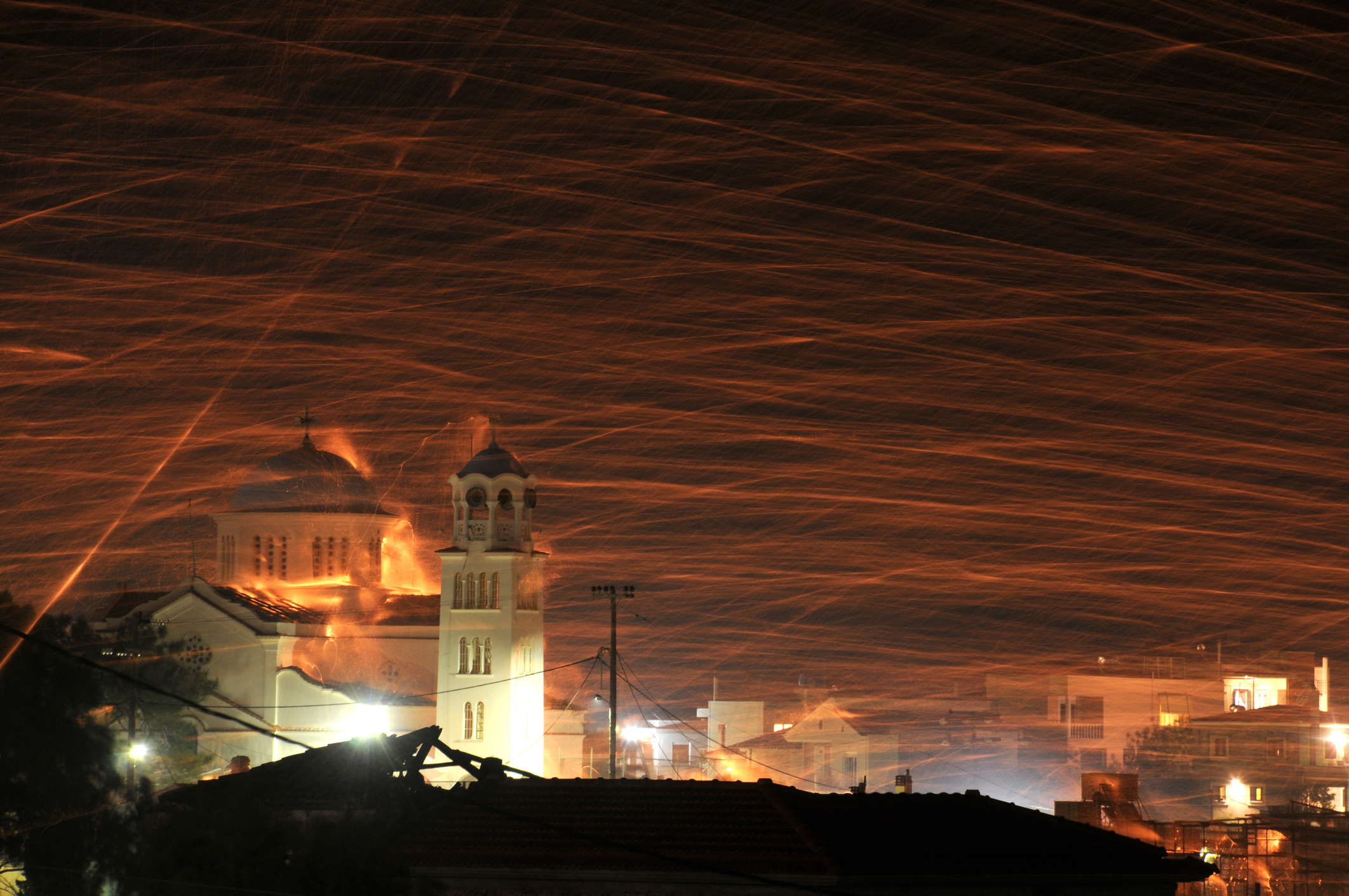 Rockets from orthodox church of Agios Markos are shooted towards church of Panagia Erythiani in a tradition that happens every easter.this is rocketwar in chios island