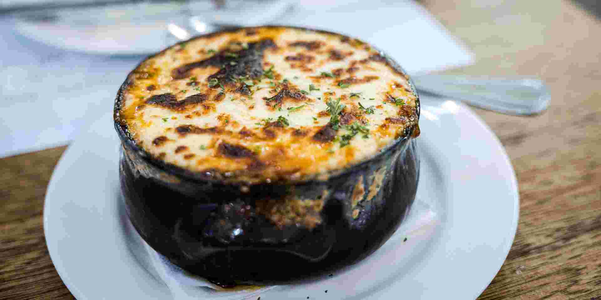 Moussaka is a very typical Greek dish. It is an eggplant- or potato-based dish and very similar to Shepherd's pie. What we had at a Greek restaurant was eggplant-based_greek summer dishes Moussaka_greek food__greek summer dishes_feature