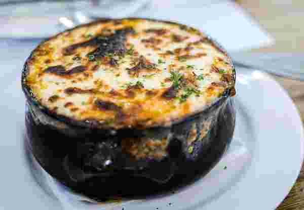 Moussaka is a very typical Greek dish. It is an eggplant- or potato-based dish and very similar to Shepherd's pie. What we had at a Greek restaurant was eggplant-based_greek summer dishes Moussaka_greek food__greek summer dishes_feature