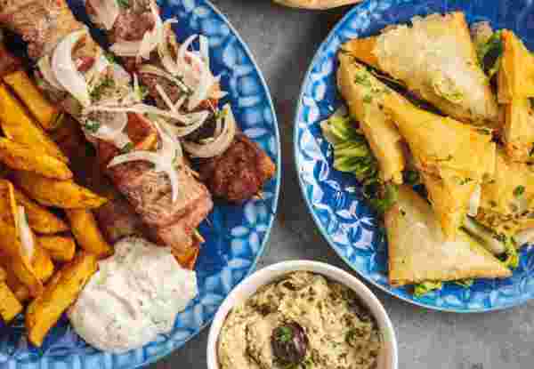 Souvlaki served with fried potatoes, tzatziki dip and pita bread, greek cuisine_greece's culinary traditions Greece food_feature_greece's culinary traditions