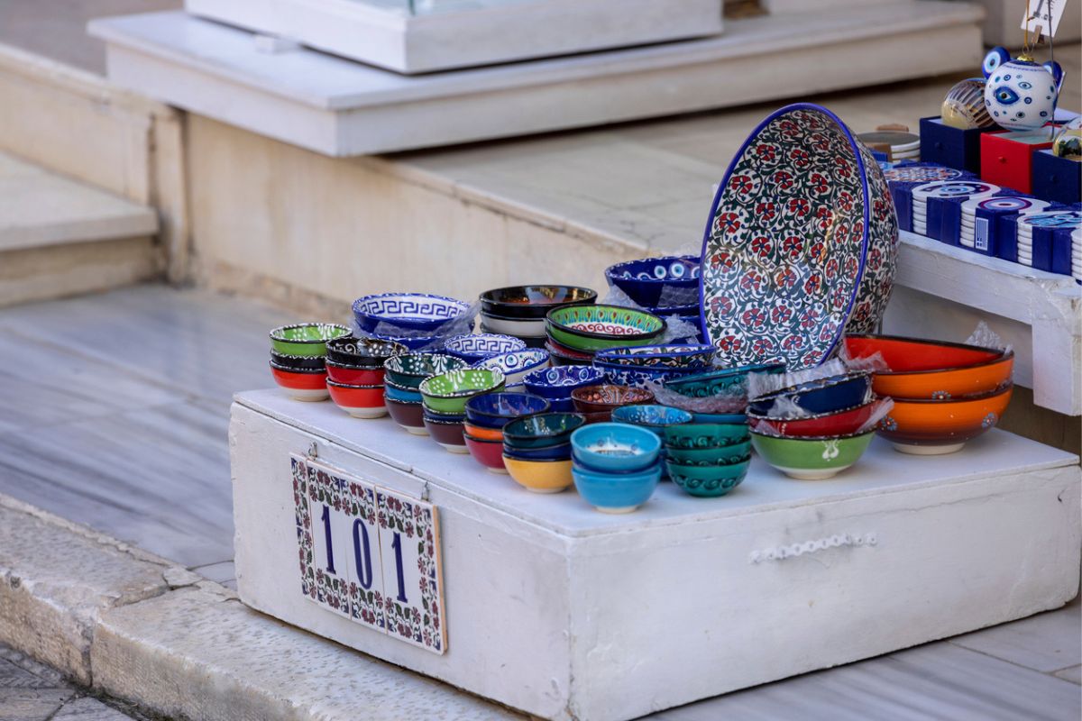 Traditional street trade on shopping street in the famous district of Plaka, shop with hand-painted colorful bowls