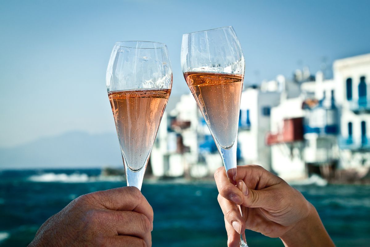 A romantic toast by the sea in Greece.