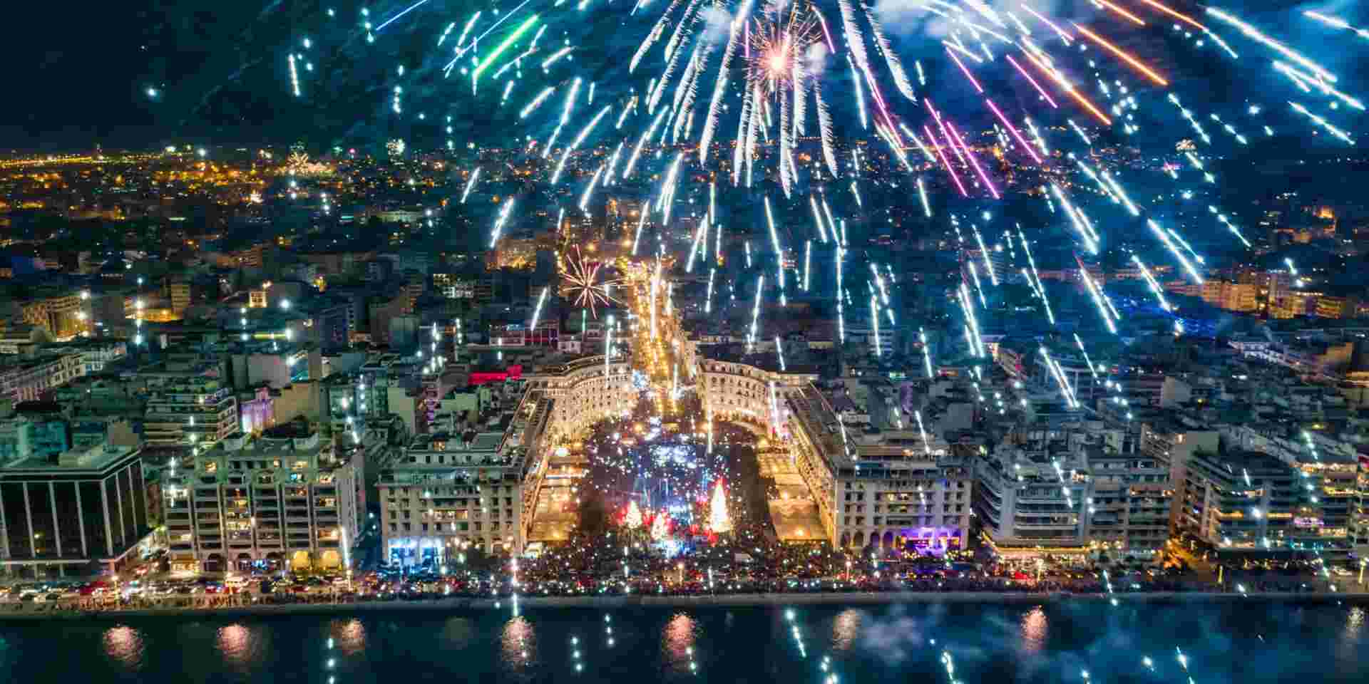 Aerial view of Aristotelous square in Thessaloniki in northern Greece during New Year 2020 celebrations with fantastic multi-colored fireworks thessaloniki new years_Greek New Year Customs_feature