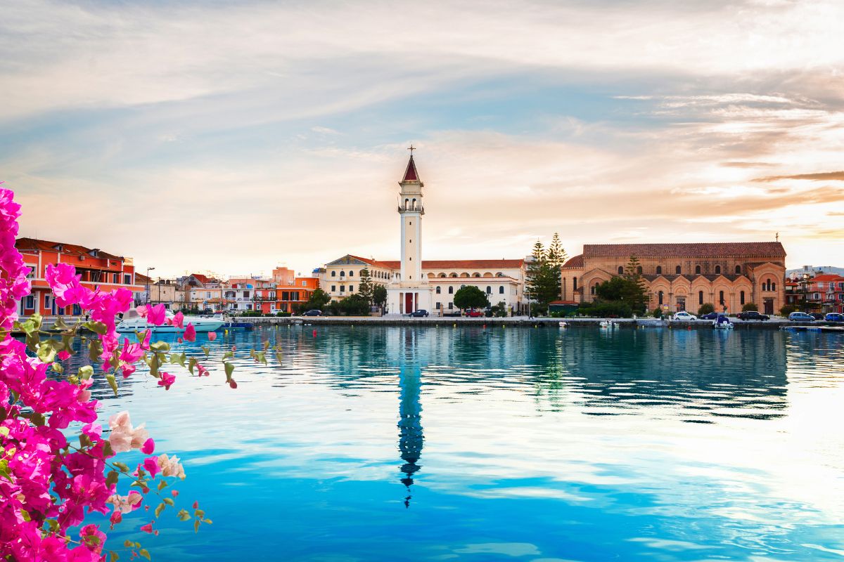 sunset over in Zaante town harbor with flowers, Zakinthos Greece