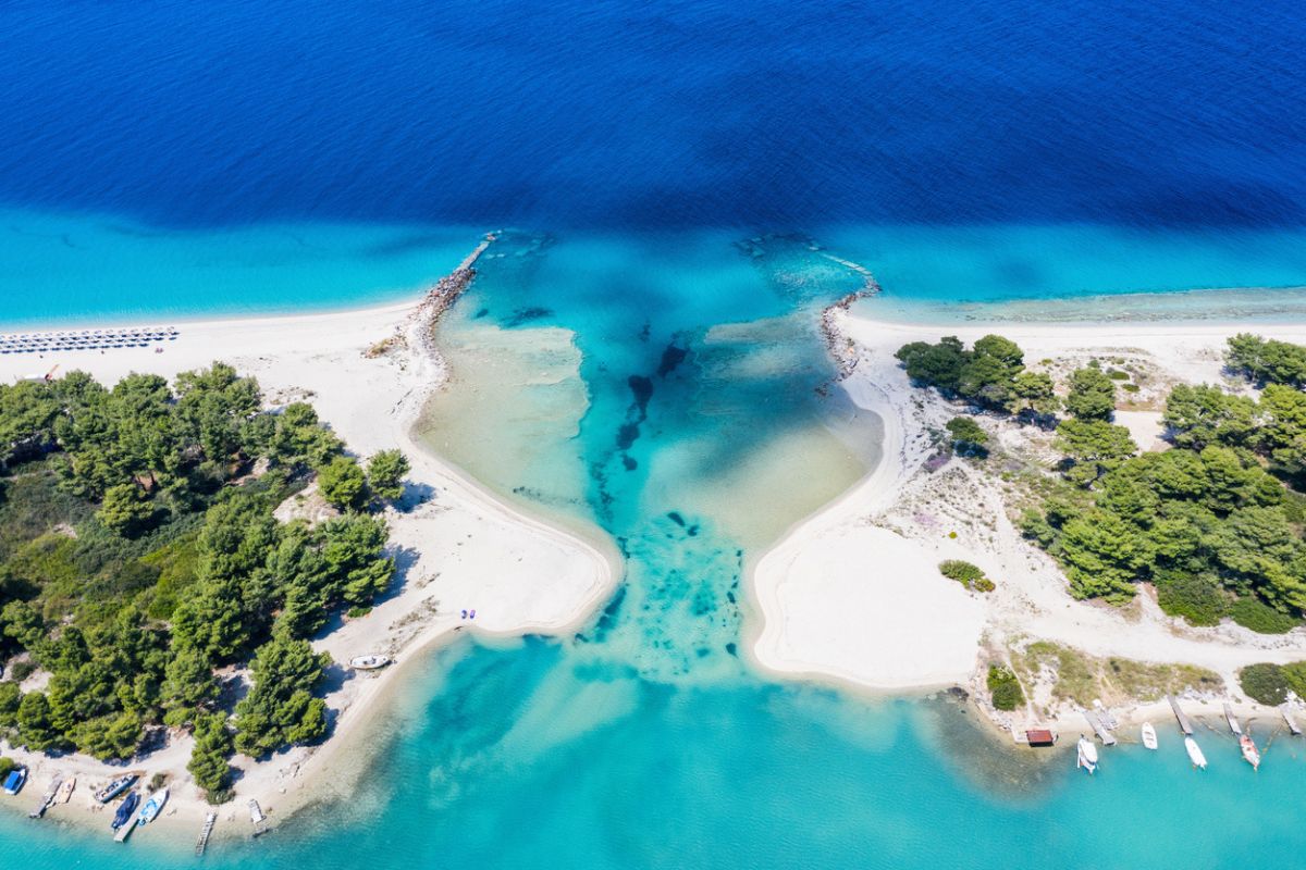 Aerial drone view of Port Glarokavos and lagoon beach in Kassandra penisula Chalkidiki Greece