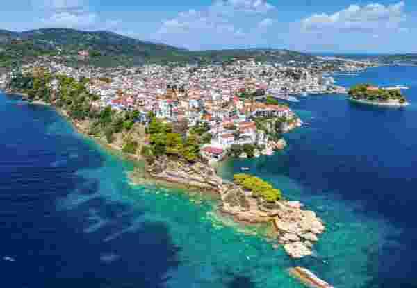 Panoramic aerial view of the town of Skiathos island, Sporades, Greece, with Bourtzi peninsula and Plakes area in front skiathos_feature