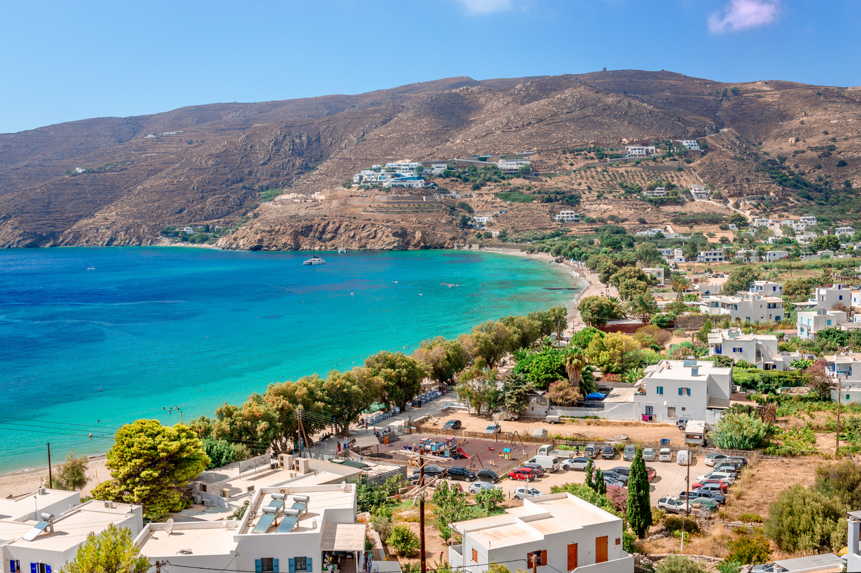 Panorama of Aigiali (or Aegiali), a picturesque fishing village on the island of Amorgos, in Cyclades, Greece. This traditional village with the whitewashed houses and the sandy beach is a very popular summer destination.