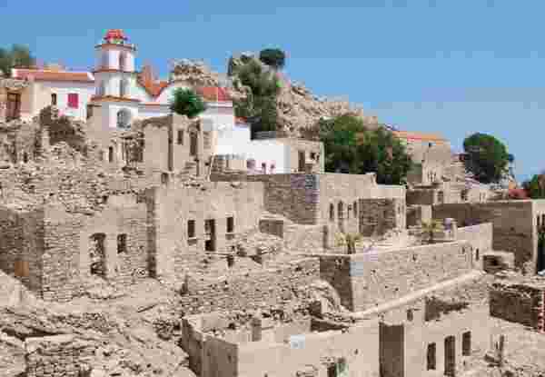 The ruins of the abandoned village of Mikro Chorio on the Greek island of Tilos. Tilos Island_feature