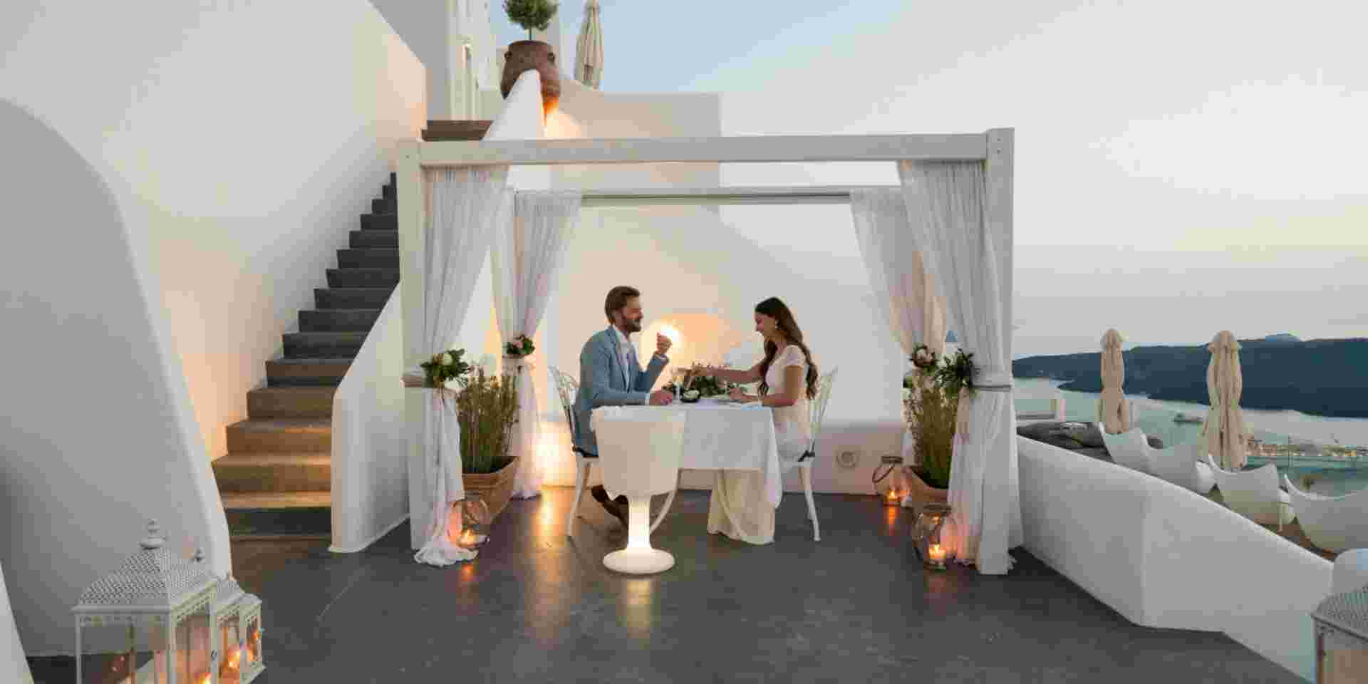 couple having candlelight dinner on romantic terrace with seaview honeymoon, vacation Honeymoon in Greece_feature