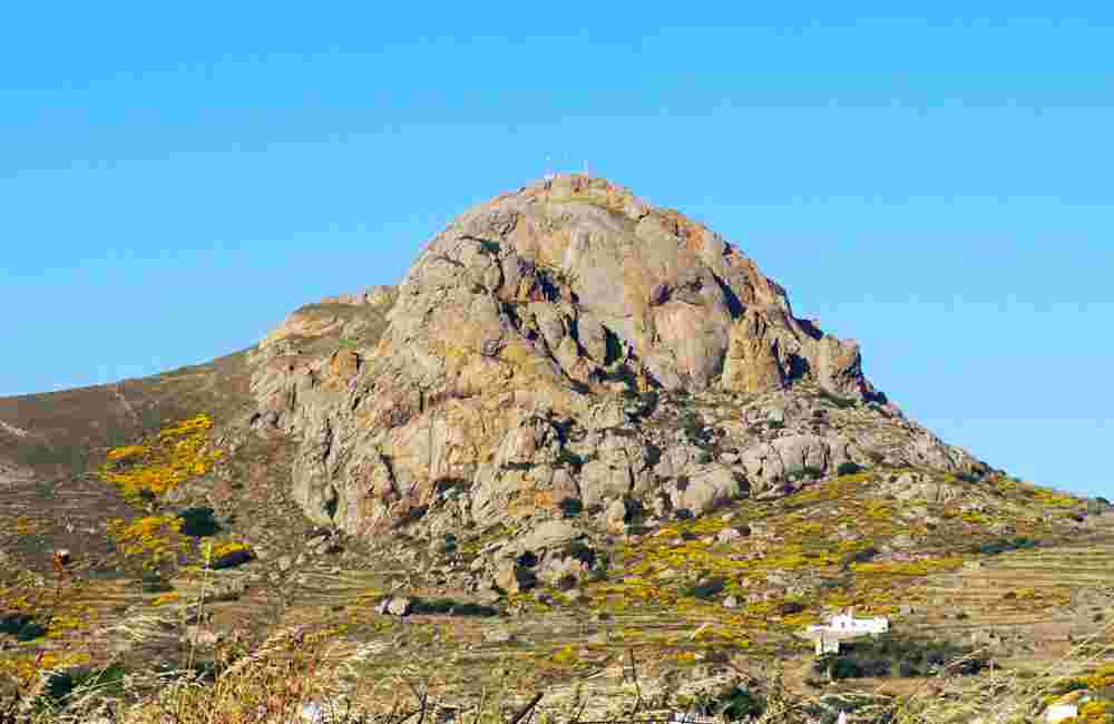 dominating the famous island of Tinos, in the Cyclades archipelago, in the heart of the Aegean Sea, the majestic Mount Exombourgo seems to watch over its inhabitants