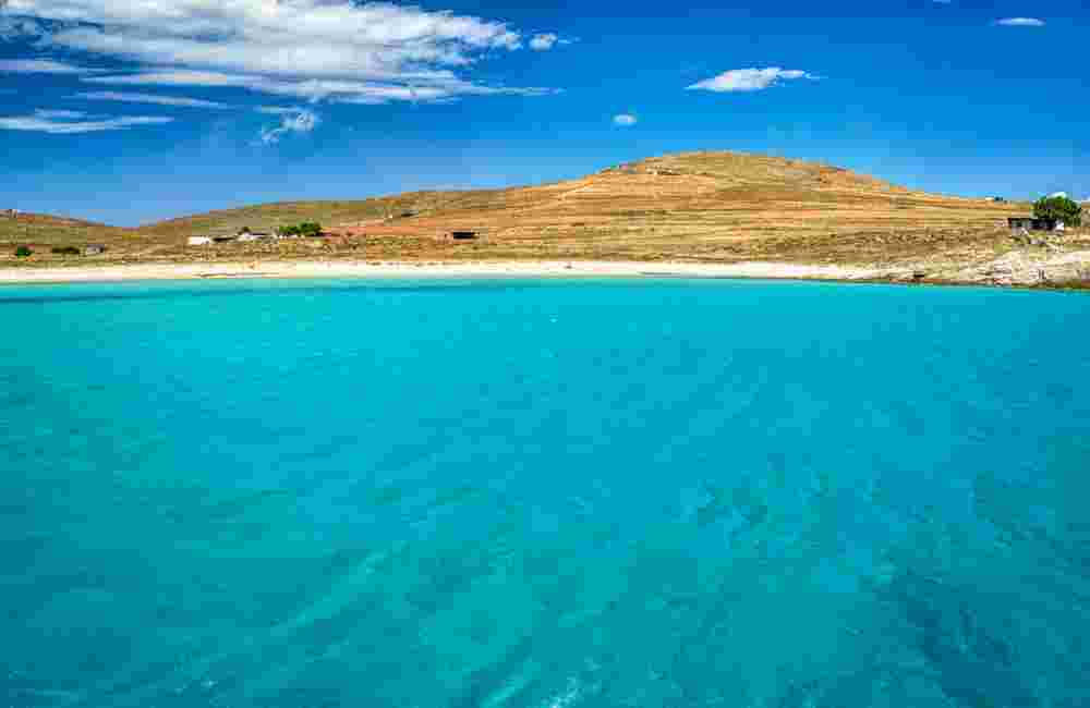 Bay in Rinia island, with clear transparent waters, Delos Mykonos Cyclades islands, Greece.