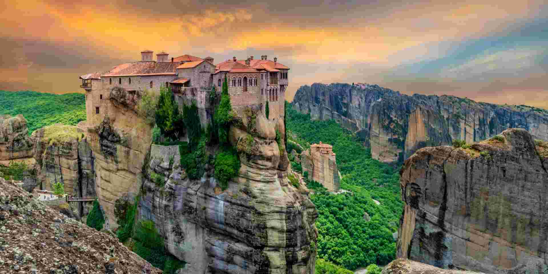 Religious Greek monastery inside the site of Meteora village at dusk meteora_once in a lifetime things to do in Greece_feature