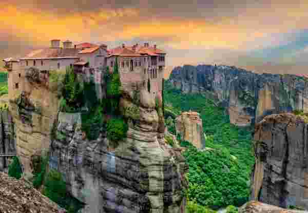 Religious Greek monastery inside the site of Meteora village at dusk meteora_once in a lifetime things to do in Greece_feature