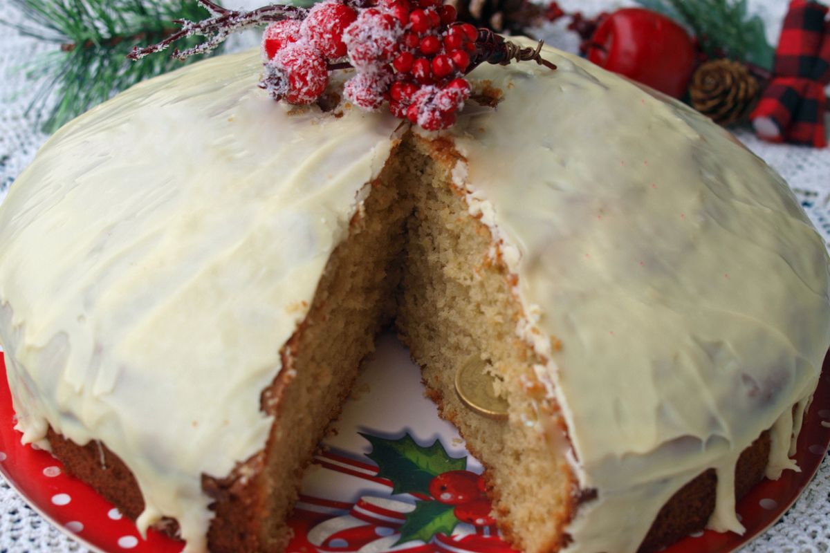 Homemade Greek Vasilopita covered in white chocolate icing 