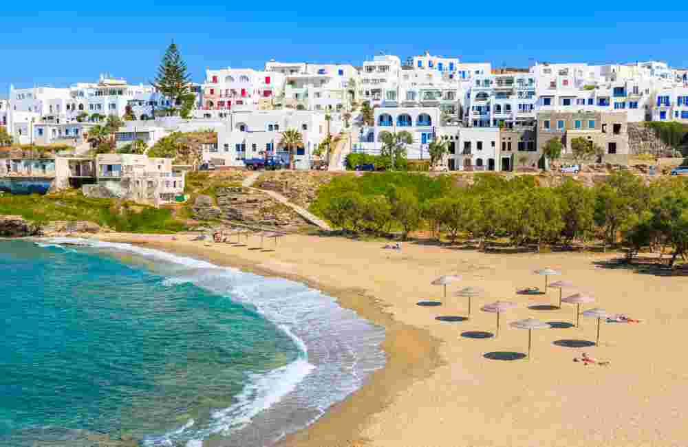 View of beautiful sea bay with beach in Naoussa town, Paros island, Greece