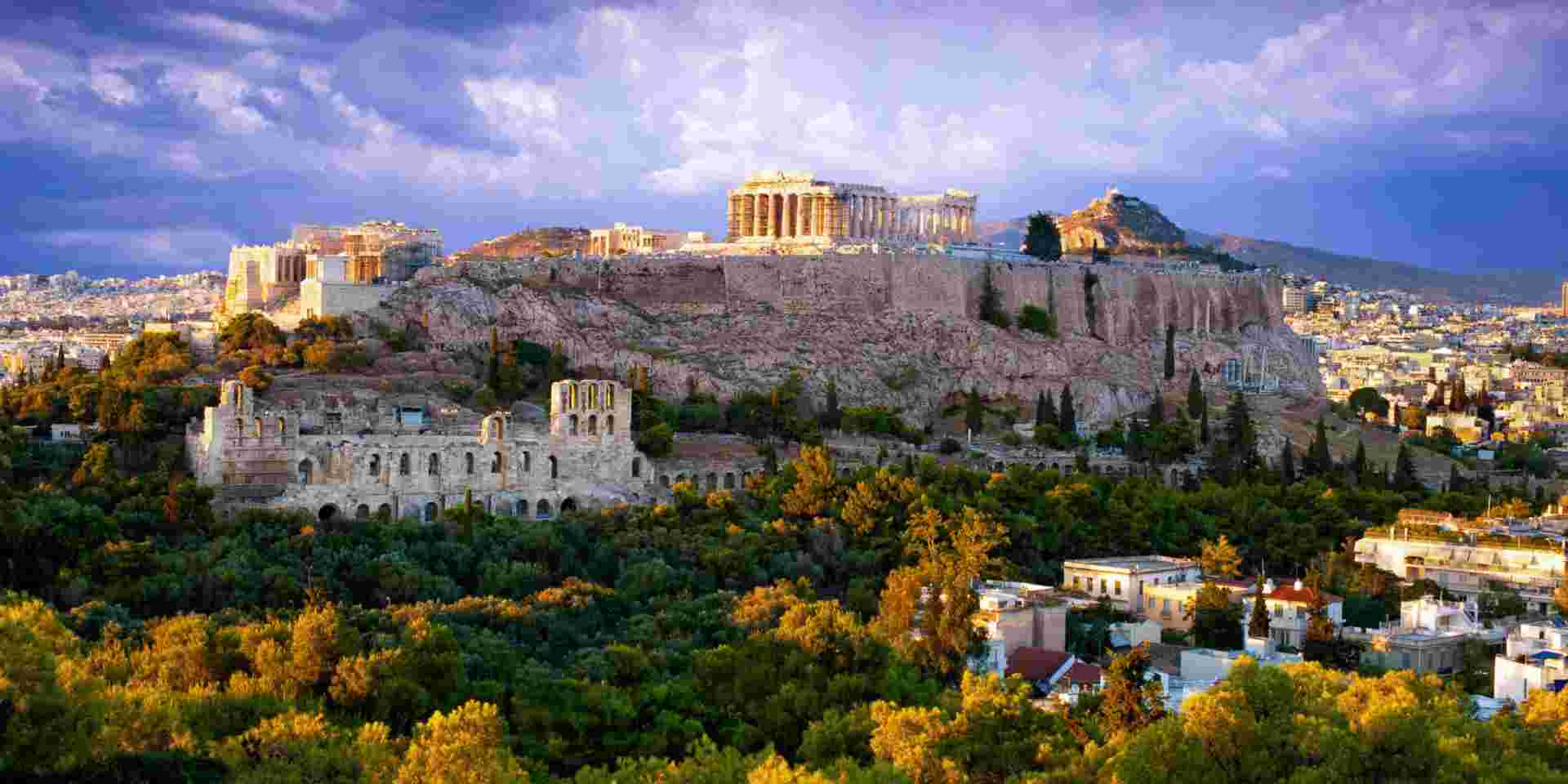 View of Parthenon Temple and Odeon of Herodes Atticus on Acropolis Hill at sunset, Athens, Greece athens in fall_weather in greece in november_feature
