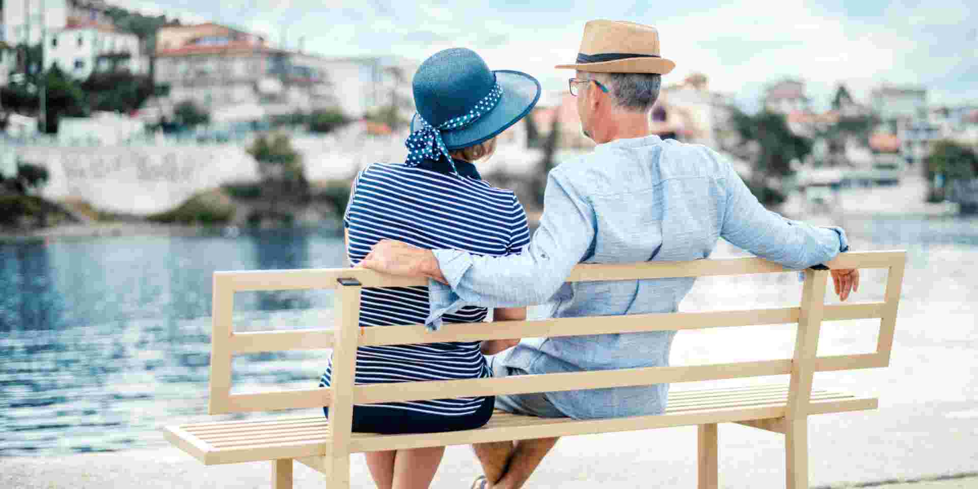 Couple looking at the distant sea view greece for seniors_feature
