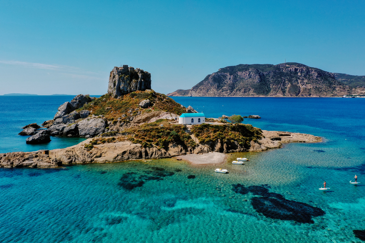 A natural view of the Kos Island and Kefalos Beach in Greece under a clear sunny sky