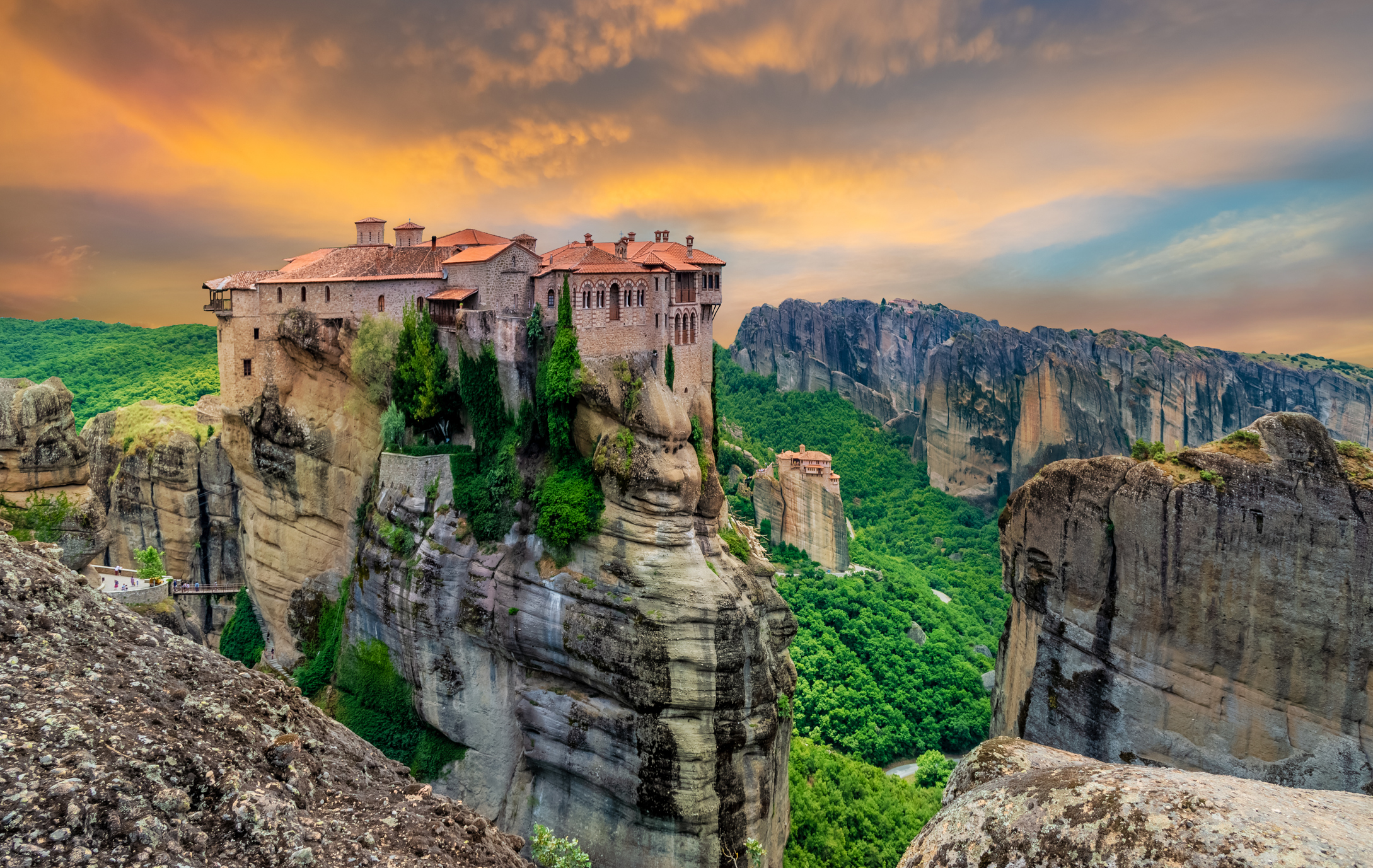 Religious Greek monastery inside the site of Meteora village at dusk
