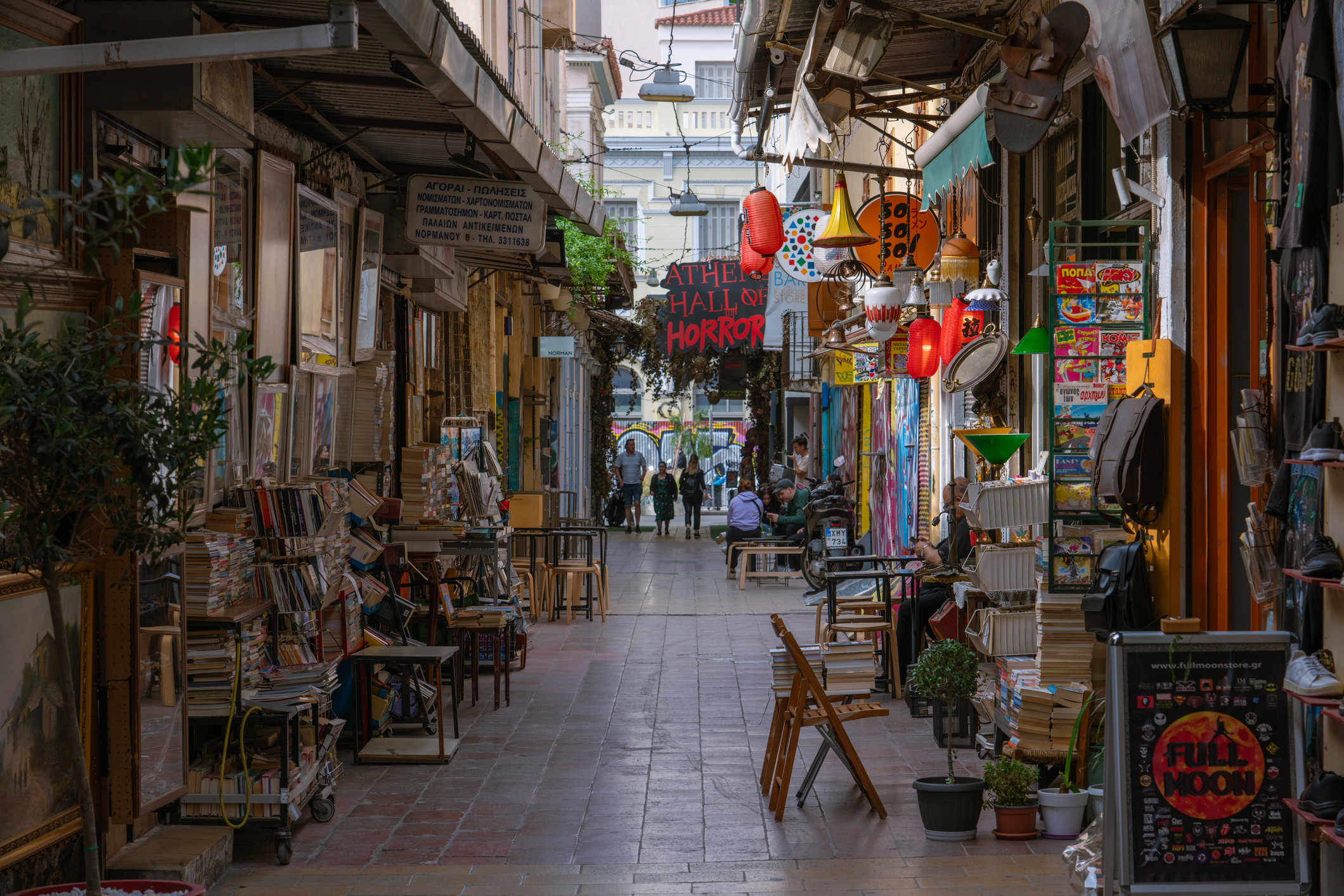 View of a street with shops and stalls at the Monastiraki Flea Market, a famous shopping area located in the old town on May 10, 2023 in Athens, Greece