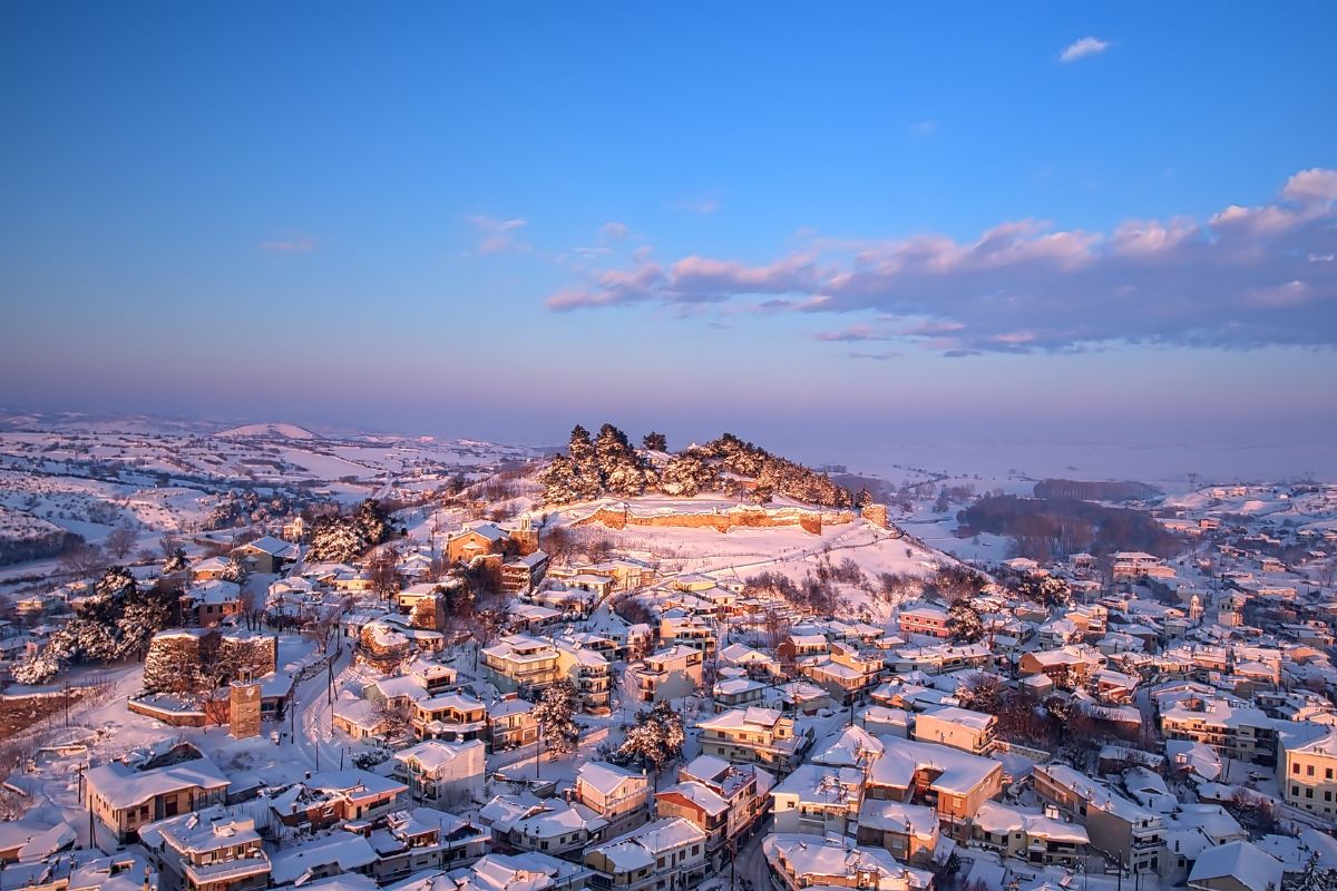 Aerial shot of a golden dawn after a week of snowstorm in the medieval town of Didymoteicho in northern Greece.
