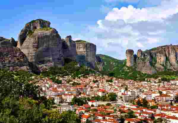 Kalampaka and Kastraki villages at foot of Meteora cliffs and pillars on sunny spring day. Greece, UNESCO World Heritage Kalampaka and Kastraki villages at foot of Meteora cliffs and pillars on sunny spring day. Greece, UNESCO World Heritage
