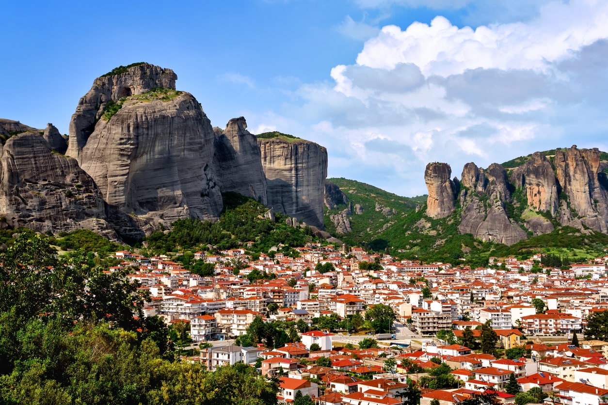 Kalampaka and Kastraki villages at foot of Meteora cliffs and pillars on sunny spring day. Greece, UNESCO World Heritage Kalampaka and Kastraki villages at foot of Meteora cliffs and pillars on sunny spring day. Greece, UNESCO World Heritage