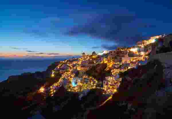 Oia in Santorini Greece at night after sunset Mykonos Greece at night