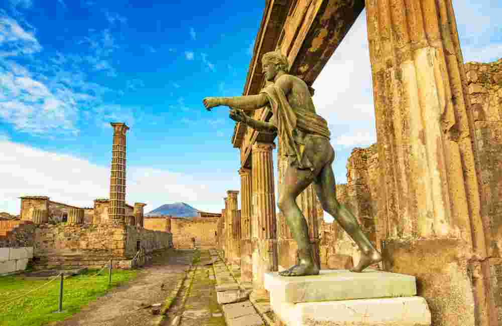 Ancient Pompeii city skyline and Apollo statue, Italy
