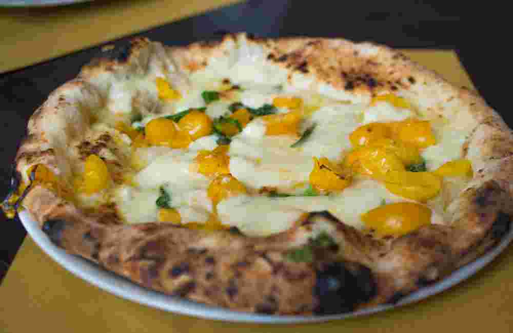 Neapolitan pizza with yellow tomato