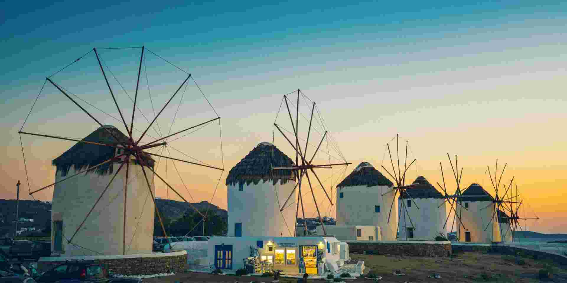 Windmills in Mykonos town (Chora), Mykonos island, Cyclades, Greece at dusk. Best time to go to mykonos_feature