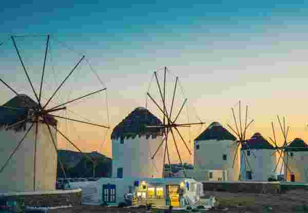 Windmills in Mykonos town (Chora), Mykonos island, Cyclades, Greece at dusk. Best time to go to mykonos_feature