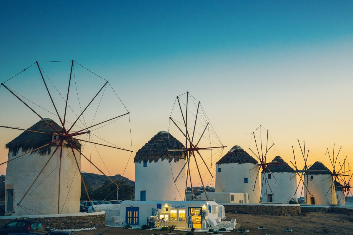 Windmills in Mykonos town (Chora), Mykonos island, Cyclades, Greece at dusk.
