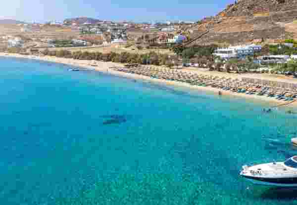 Aerial view to the popular Kalafatis Beach on Mykonos island with pristine, clear sea, Cyclades, Greece kalafatis beach mykonos_where to stay in mykonos_feature