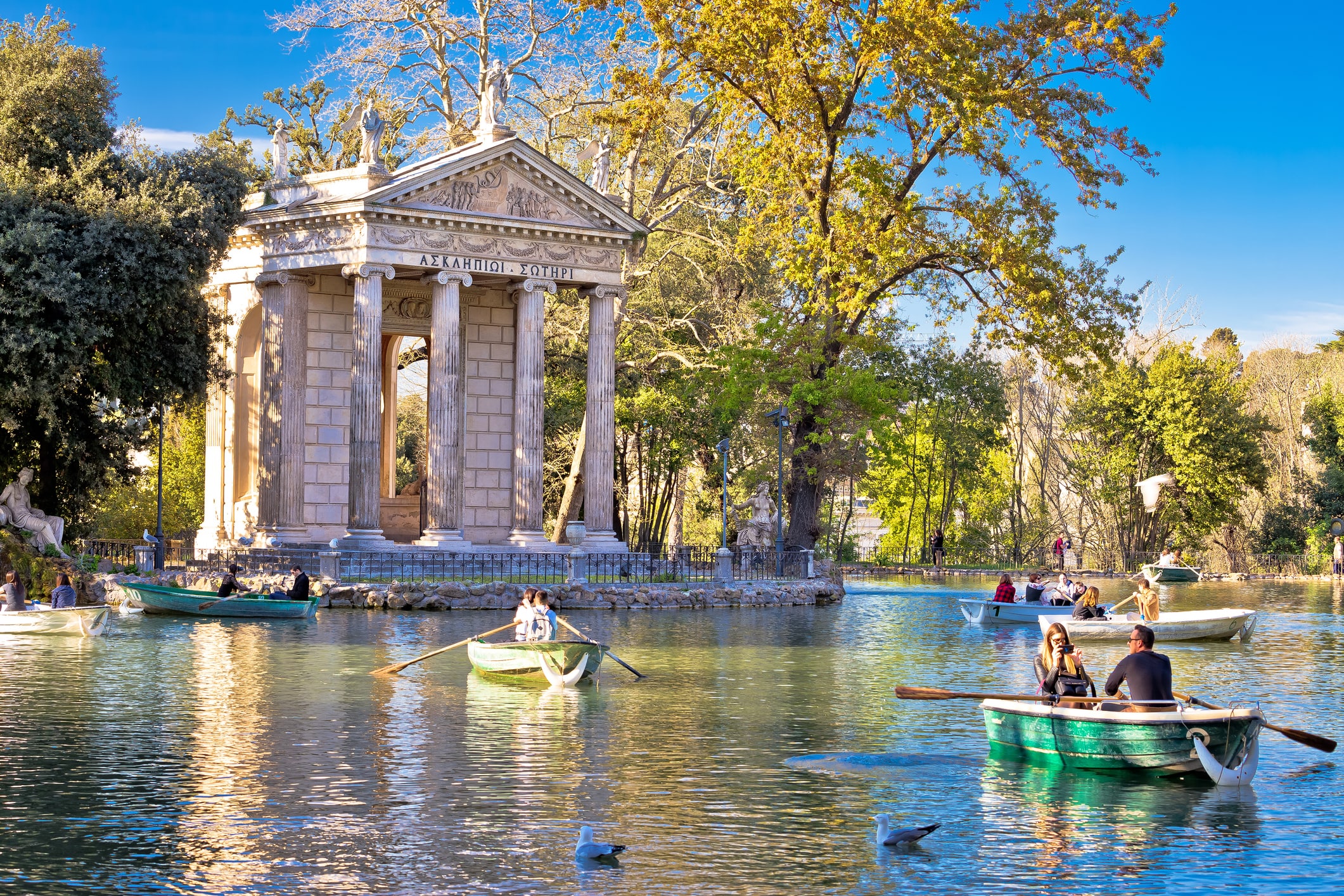 Rome, Italy, March 25 2019: Laghetto Di Borghese lake and Temple of Asclepius in Rome, capital of Italy. People enjoying in nature in famous tourist destination.