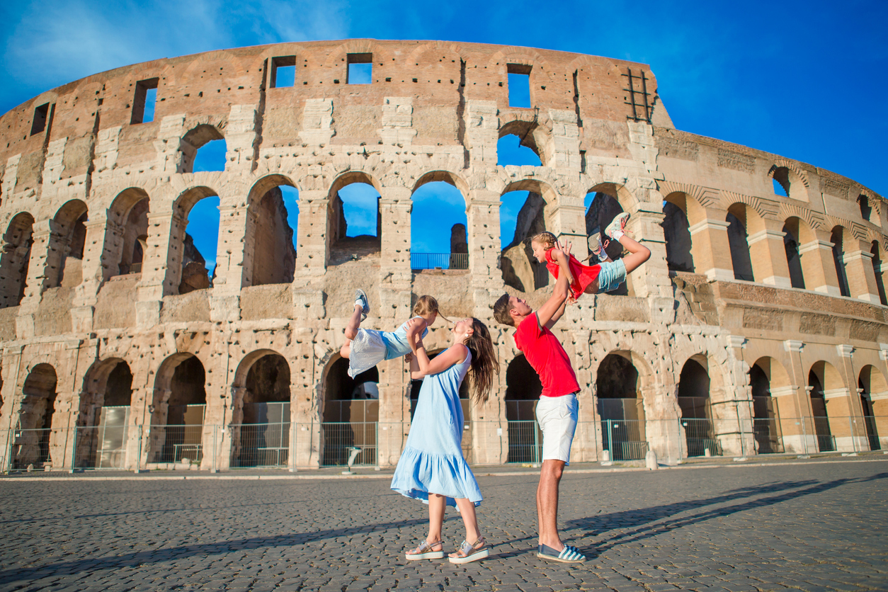 Happy family in Rome over Colloseum background