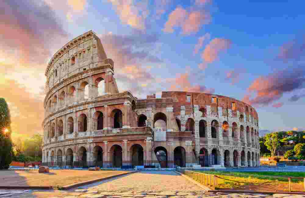 Rome, Italy. The Colosseum or Coliseum at sunrise.