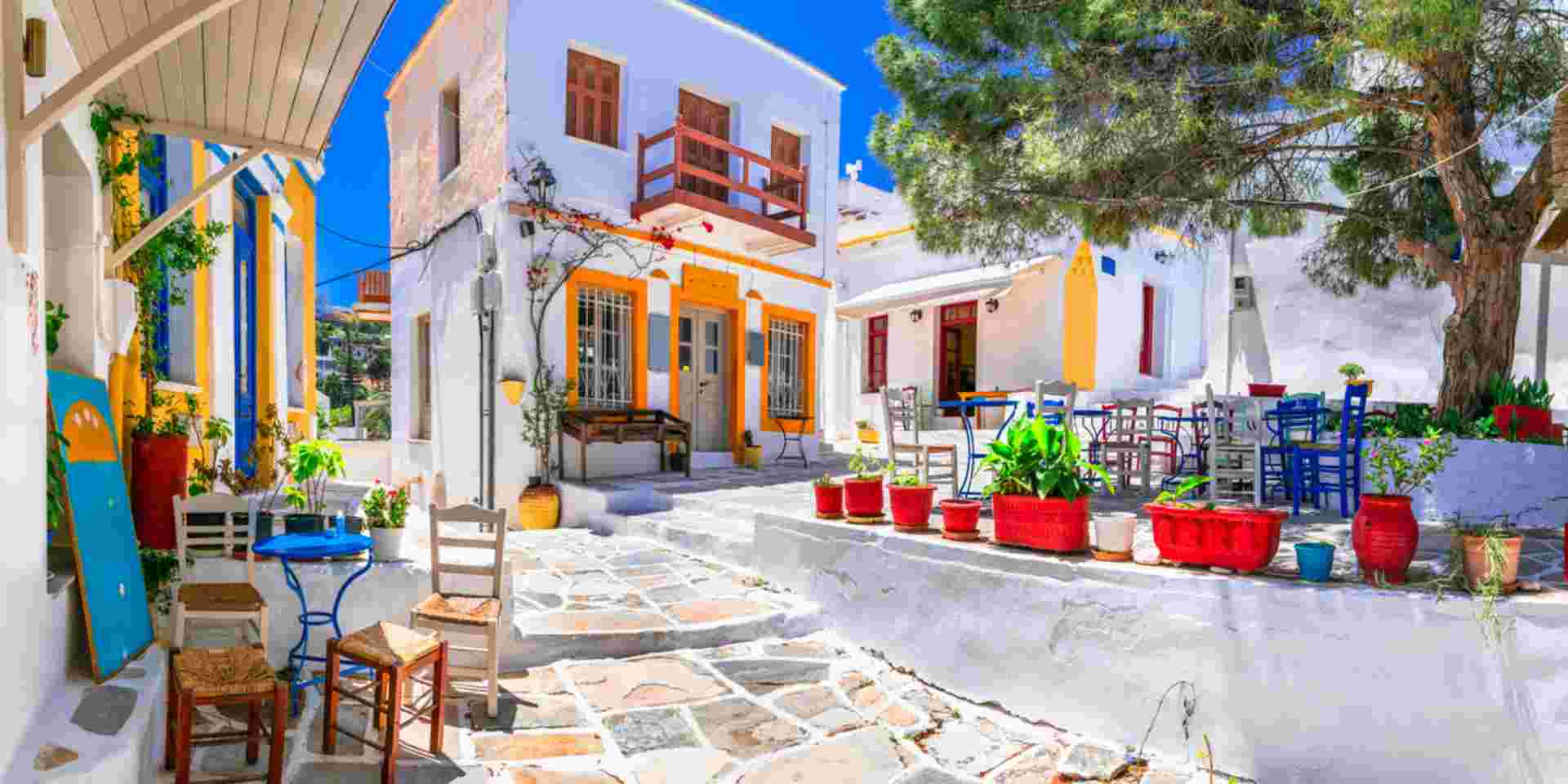 Beautiful Lefkes traditional greek village in Paros island. Charming coffe bars and taverns in colorful narrow streets. Cyclades , Greece Honeymoon in Paros_feature