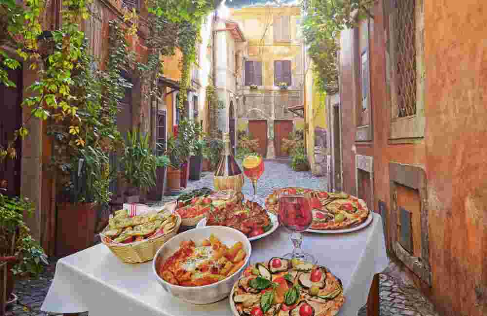 Pasta , pizza  and homemade food arrangement  in a restaurant  Rome