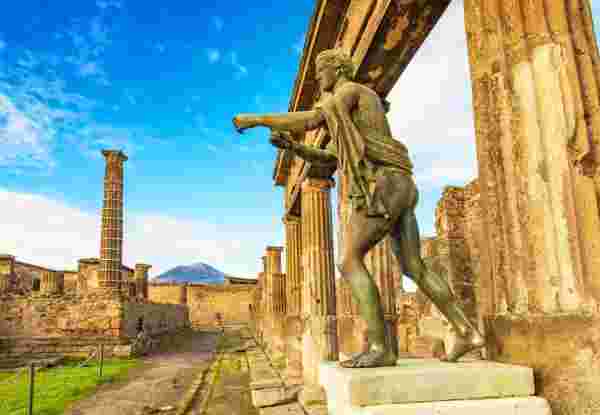 Ancient Pompeii city skyline and bronze Apollo statue, Italy travel photo rome to pompeii_feature