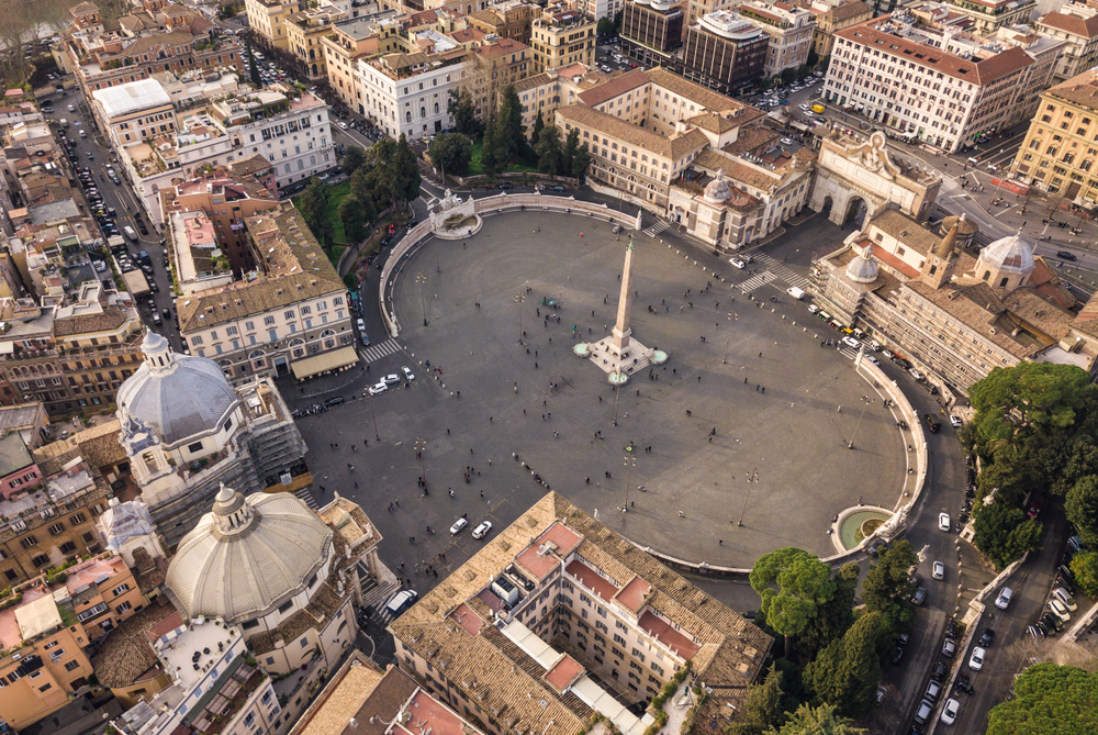 Aerial view of Piazza del Popolo with its central obelisk and surrounding historic architecture.